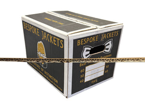 Cardboard box labeled 'Bespoke Jackets' with branding and text on a white background with close-up of box corrugation
