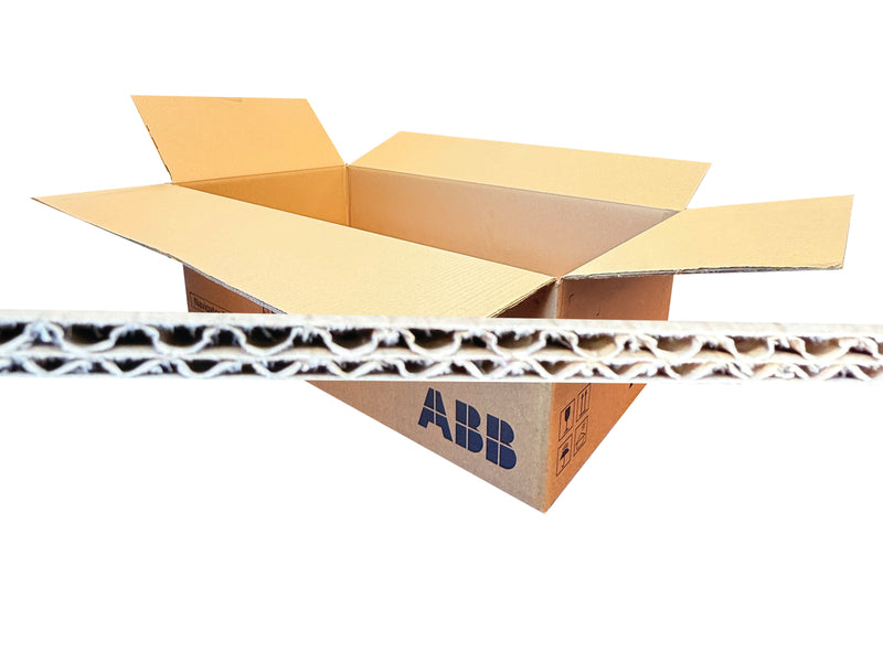 An open brown corrugated cardboard box with flaps extended, shown on a white background with a close-up horizontal strip of the box's wavy cardboard wall in front.