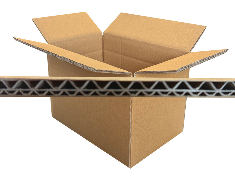 An open brown corrugated cardboard box with flaps raised, shown on a white background with a close-up horizontal strip of the cardboard wall in front.