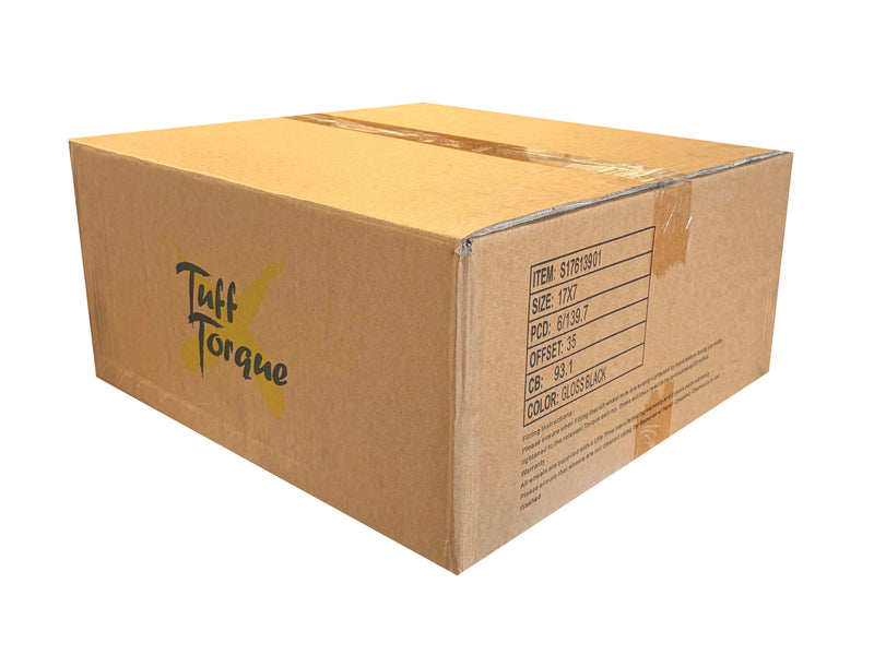 A brown cardboard box with 'Taff Torque' printed in black and yellow on the side, sealed with clear tape, on a plain white background.