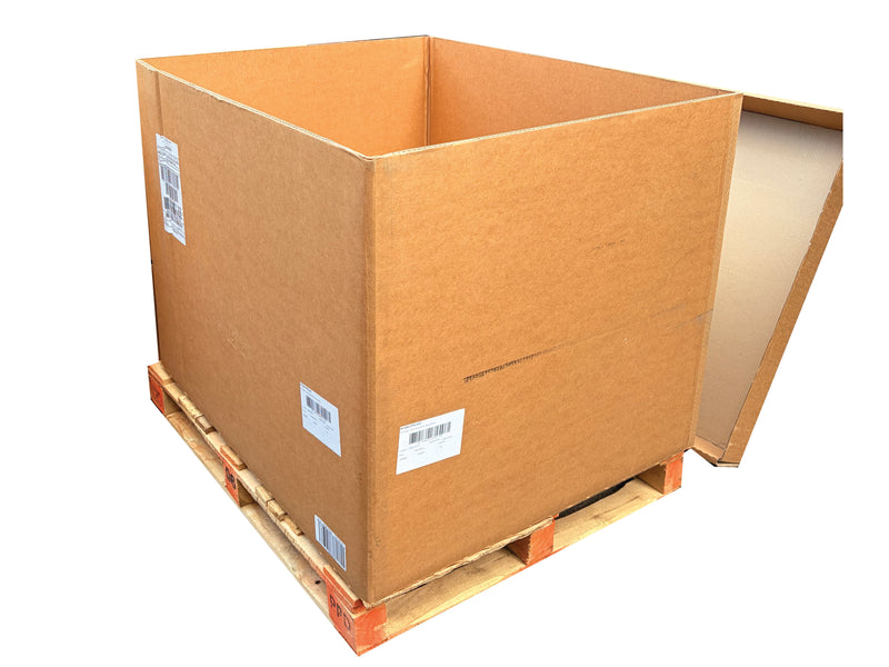 Large cardboard box on a wooden pallet with labels on a white background