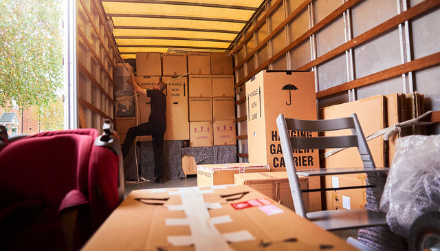 packing a removals van with used boxes and wardrobe boxes