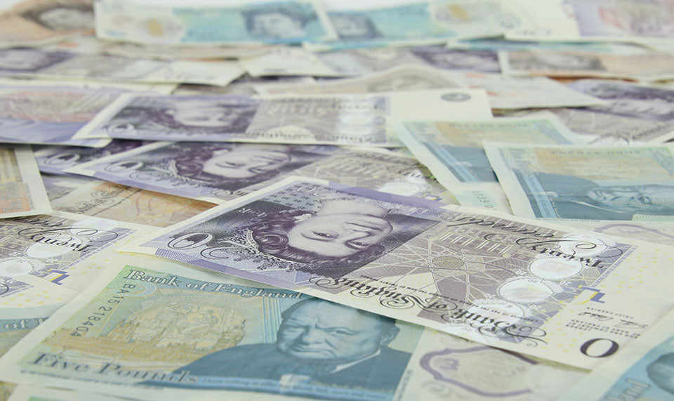 financial rewards for cardboard box reuse instead of baling and recycling, as shown by British bank notes